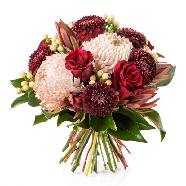 A red round hand-tied bouquet created with the finest blooms of the season.