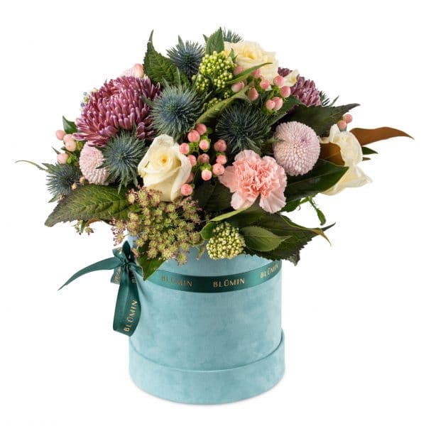 A vibrant hatbox arrangement featuring the freshest flowers and beautifully textured elements artfully arranged in our sophisticated hatboxes.