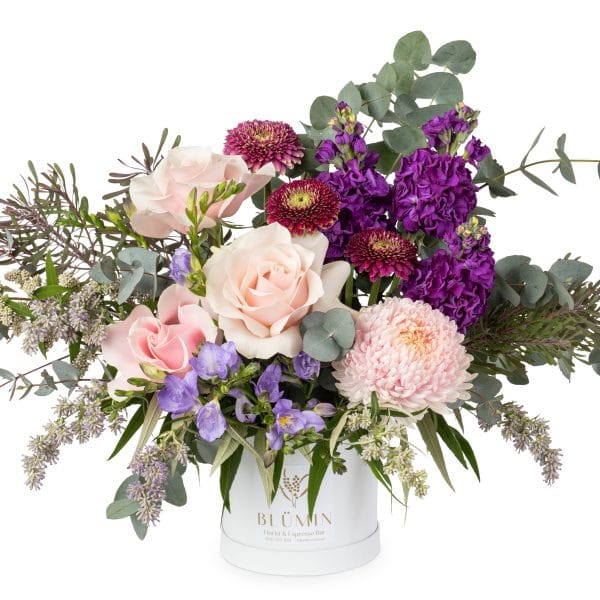 This stylish soft and pretty arrangement comes in a beautiful array of purple amethyst tones framed by interesting textural foliage. Perfect for any occasion, especially birthdays and gifts.
